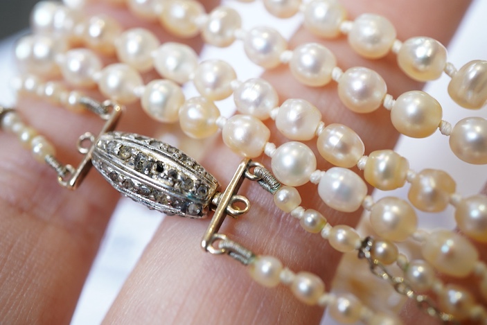 A natural pearl and diamond necklace, early 20th century